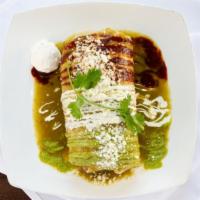 Wet Burrito · Burrito stuffed with your choice of meat, rice and beans covered with your choice green or r...