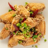 Salt & Chili Garlic Wings · Fried chicken wings seasoned with salt, pepper, garlic and jalapeños.