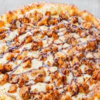 Bbq Chicken Pizza · Lots of BBQ sauce, chicken marinated in BBQ sauce and mozzarella cheese.
