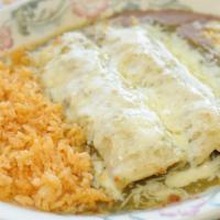 Suiza Enchiladas · Two com tortillas stuffed with your choice of filling, topped with a delicious green tomatil...
