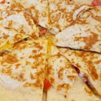 Quesadillas · Soft flour tortillas stuffed with melted cheese, onions and tomatoes. Served with guacamole ...