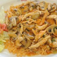 Arroz Con Pollo · Boneless breast of chicken sautéed in a special sauce with mushrooms and spring onions, then...