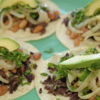 Tacos El Sol · Four soft corn tortillas filled with chopped skirt steak or grilled chicken, fresh cilantro,...