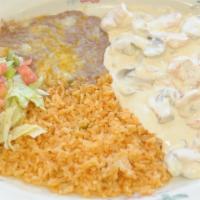 Camarones A La Crema · Shrimp and mushrooms prepared in a delicious cream sauce, served with rice, beans and tortil...