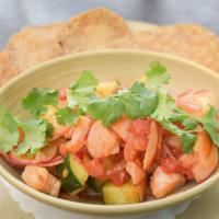 Shrimp Ceviche · Poached shrimp, cucumber, onion, tomatoes, guajillo-vinegar sauce, cilantro, and tostadas. (...