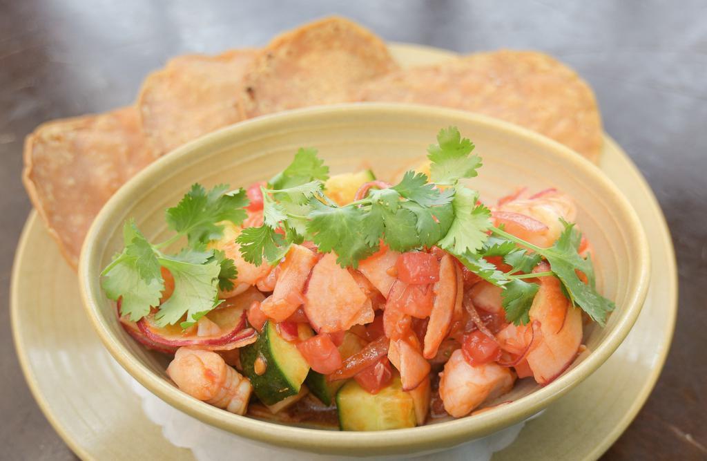 Shrimp Ceviche · Poached shrimp, cucumber, onion, tomatoes, guajillo-vinegar sauce, cilantro, and tostadas. (spicy)
