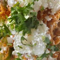 Chicken Tinga Tacos · Three chipotle braised chicken breast tacos, avocado, diced onion, cotija cheese, crema, cil...