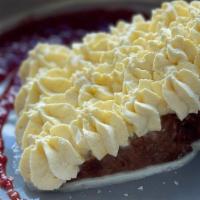 Corn Tres Leches Cake · Corn cake soaked in three milks, and topped with corn whipped cream, and savory strawberry p...