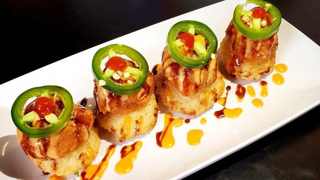 Spicy Tuna On Crispy Rice · Spicy. Spicy tuna mix on crisped rice, jalapeño, eel sauce, spicy mayo, sriracha. This item may contain raw or undercooked ingredients or may be cooked to order. Consuming raw or undercooked meats, poultry, seafood, shellfish or eggs may increase your risk of food borne illness.