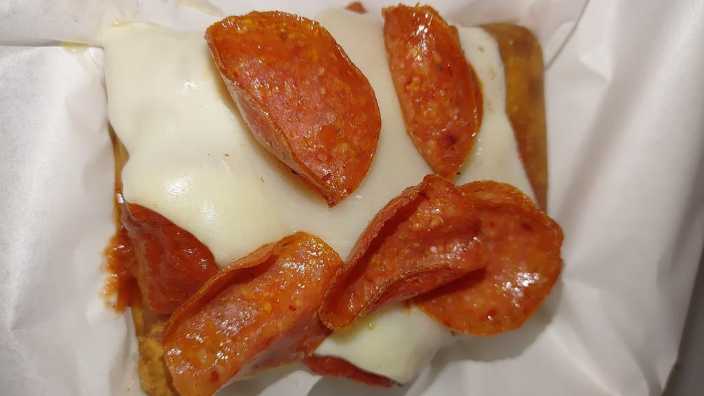 Pizza Puff Supreme · Pork, mozzarella cheese, pizza sauce and spices wrapped in a tortilla and deep fried then topped with marinara, pepperoni and more melted mozzarella