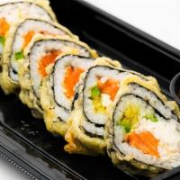 Las Vegas Roll · Salmon, crab mix, avocado, and cream cheese inside, tempura fried and drizzled with spicy ai...