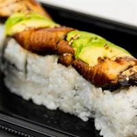 Dragon Roll · Shrimp tempura, crab mix, and cucumber, topped with baked fresh water eel, avocado and eel s...