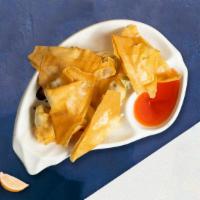 Crawling Ragoon · (4 pieces) golden fried wontons stuffed with cream cheese and crab meat served with sweet an...