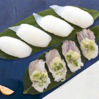 Epic Ika Nigiri · Slices of squid gently pressed over tender cooked rice.
