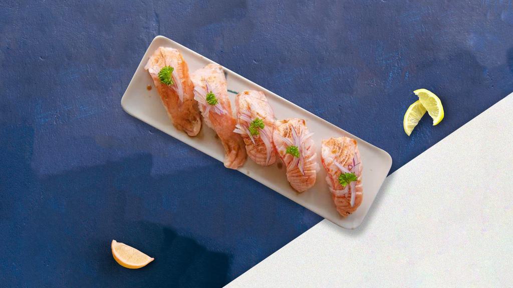 Smoked Salmon Nigiri · Slice of smoked salmon gently pressed over tender cooked rice.