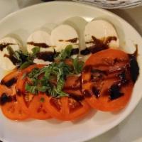 Caprese · Fresh mozzarella, tomato, basil. Topped with balsamic reduction and olive oil.