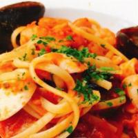 Linguine Ai Frutti De Mare · Linguine with mussels, clams, calamari, shrimp, light tomato sauce, chili flakes, garlic and...