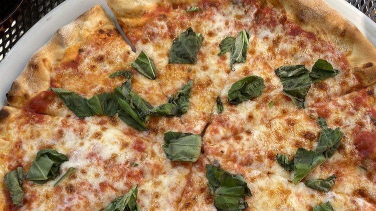 Margherita Pizza · Tomato sauce and mozzarella topped with fresh basil.
