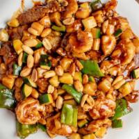 Kung Pao Chicken · Diced chicken stir-fried with green pepper, onion, zucchini, water chestnuts & roasted peanu...