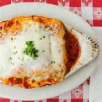Mama’S Baked Lasagna · Italian sausage and ground beef layered in pasta with mama's secret blend of cheese and spice.