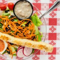 Italian Dinner Salad · Iceberg and romaine blend with carrots, celery, radish, tomato, pepperoncini pepper, black o...