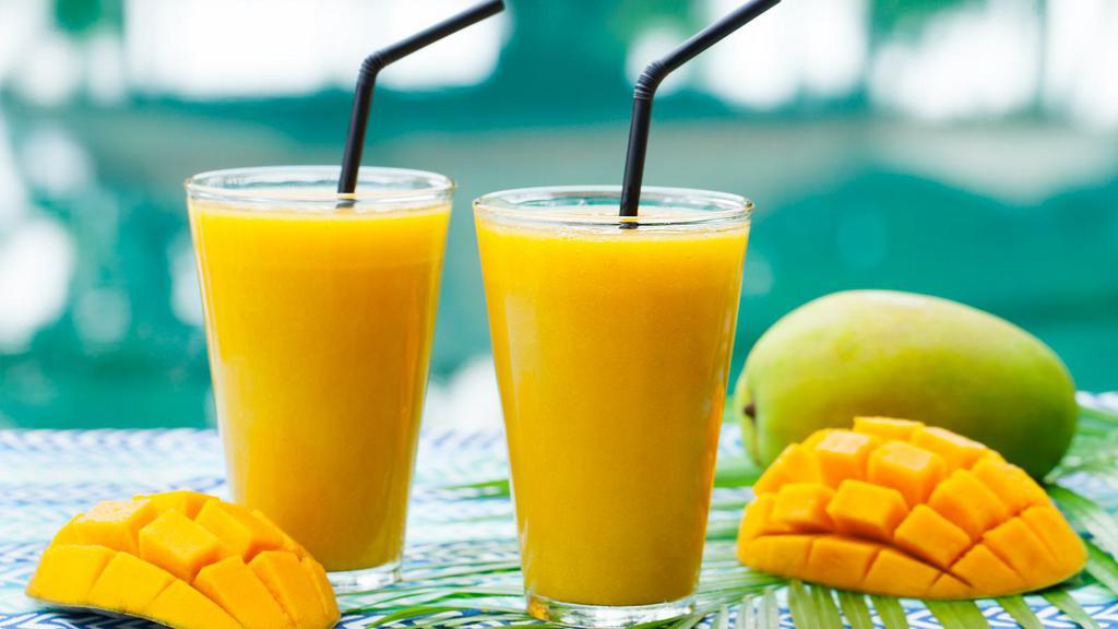 Mango Smoothie · Refreshing mango smoothie with milk.