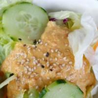Green Salad · Green salad with house ginger dressing.