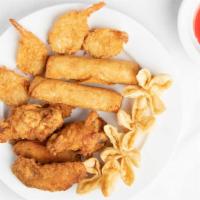 Appetizer Combo · Two egg rolls four coconut shrimp, four chicken wings four cheese wontons.