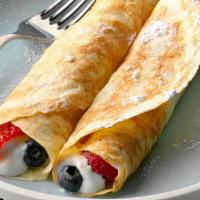 Fruit Crepes · Filled with strawberries, bananas topped with sugar & Nutella.