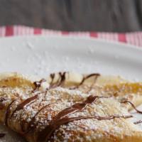 Nutella Chocolate Crepes · Nutella sprinkled with powdered sugar.