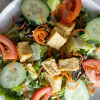 Tofu Salad · Fresh green salad topped with fried tofu. Served with your choice of peanut sauce or sesame ...