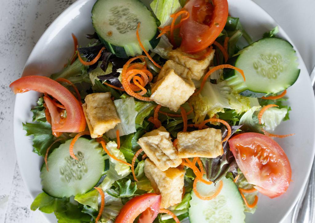 Tofu Salad · Fresh green salad topped with fried tofu. Served with your choice of peanut sauce or sesame dressing.