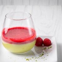 Matcha Panna Cotta With Raspberry Coulis · The famous Italian creamy dessert flavored with matcha tea.
