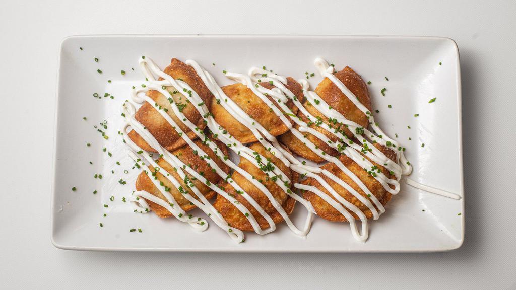 Cheddar & Potato Pierogies · Vegetarian. Cheddar cheese and golden potatoes fill this delicious pierogi. Topped with sour cream and chives. *filling cannot be modified