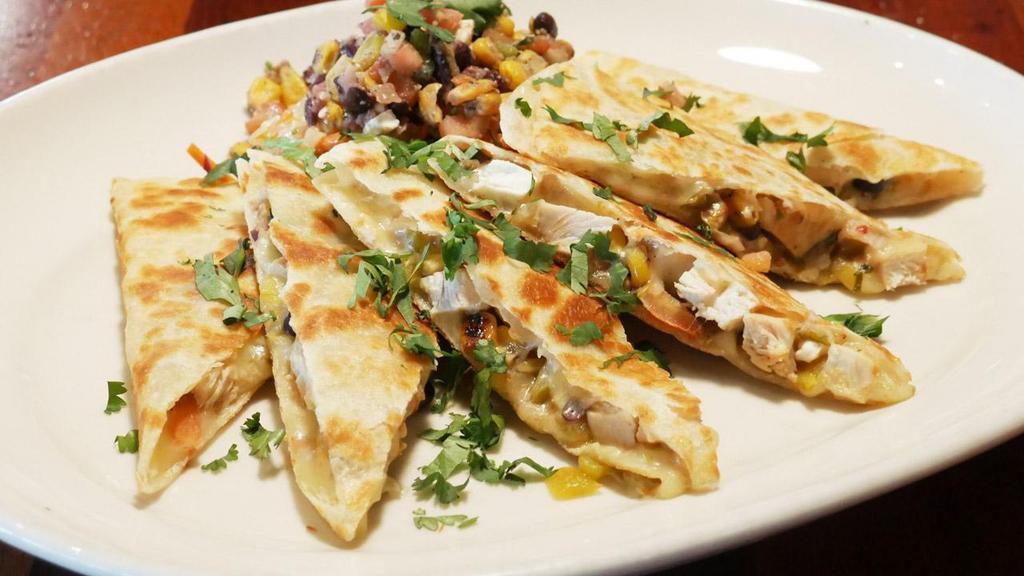 Pepper Jack Quesadilla · tortillas, marinated chicken, pepper jack cheese, corn and black bean relish, chiles, salsa, tarragon slaw, cilantro