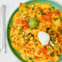 Nachos Azteca™ · Azteca's award winning nachos! Crisp, corn tortilla chips topped with beans, jalapeños and m...