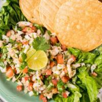 Ceviche · Gluten free. Praws in lime juice, onions, tomatoes, jalapenos, cilantro, garlic, salt and bl...