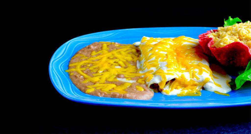 Enchiladas A La Crema · Enchiladas smothered with a rich, decadent cream sauce and cheddar cheese. Tastes best with chicken.
