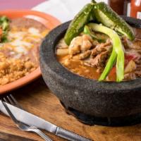 Molcajete™ · A Mexican style stew of chicken or steak (or choose a combination of chicken and steak) saut...