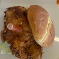 Southern Fried Chicken Sandwich · Buttermilk fried chicken breast with a Tabasco infusion on a toasted brioche bun. Served wit...