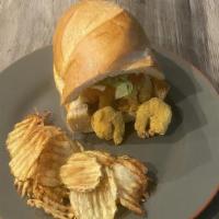 Shrimp Po'Boy · Crispy deep-fried shrimp coated in spicy cornmeal batter served on French bread with scratch...