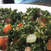 Tabouli Salad · Vegan. Finely chopped fresh parsley mixed with mint, green onion, tomato, bulgar, lemon juic...