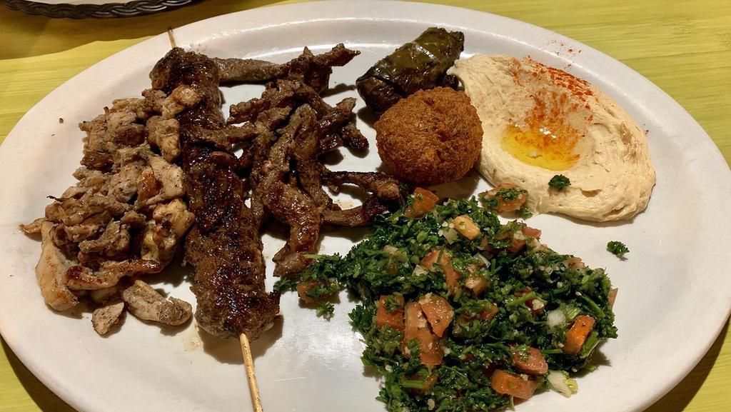 Meat Mezza · Meat. Kafta (ground beef, parsley, onions, and traditional spices), chicken shawarma, falafel, hummus, baba ghannouj, tabouli, and grape leaves.