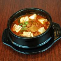 Kimchi Jjigae · Spicy. Kimchi soup with pork and tofu.