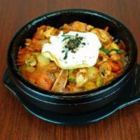 Haemul Dolsot Bibimbap · Spicy. Spicy mixed seafood stir fry and an egg over rice in a hot stone pot.