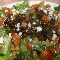 Greek Salad · Chicken or gyro meat, romaine lettuce, cucumber, tomato, walnuts, feta cheese, and Greek dre...
