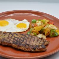 Steak & Eggs · Grilled skirt steak scrambled with three eggs, with tomatoes, onion and red and yellow peppe...