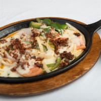 Queso Fundido · Melted jack cheese with 'Chorizo' (Mexican sausage), green onions and tomatoes. Served with ...