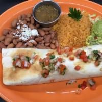 Carnitas Burrito · Large flour tortillas filled with beans and delicious pork carnitas and pico de gallo, smoth...