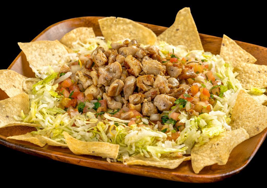Fili'S Chicken Salad · Corn tortilla chips, grilled chicken, pico de gallo, and lettuce.
